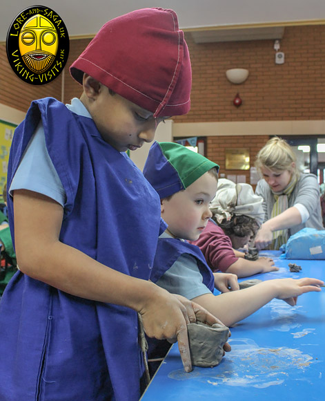 Children making a clay oil lamp on a Viking activity day run in school by Lore and Saga. - Image copyrighted  Gary Waidson. All rights reserved.